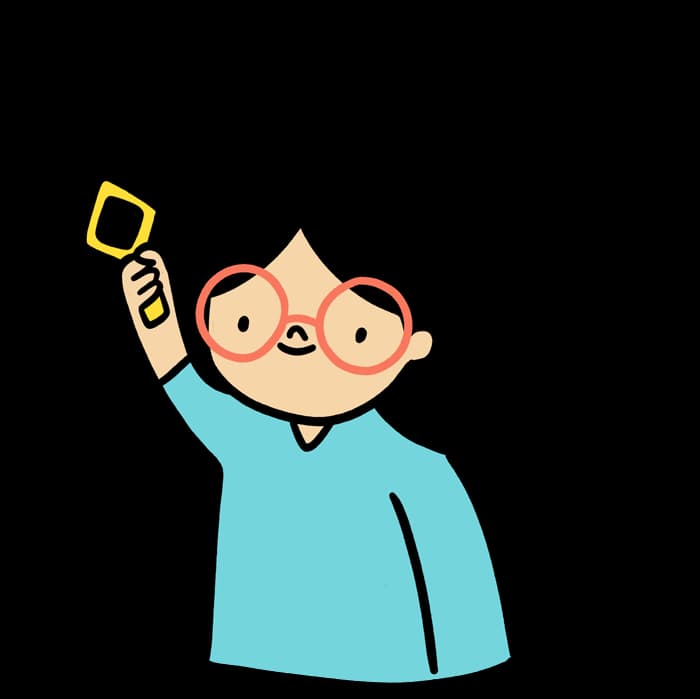 A happy child holding up a card